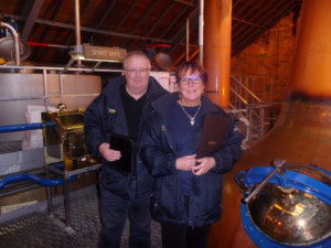 Liz and Paul iln the still room at The Speyside Distillery