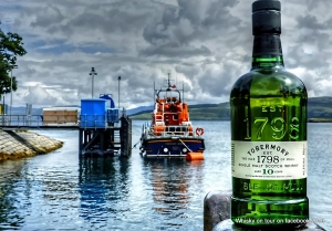 bottle of Tobermory whisky with a wrecked boat on the isle of Mulll